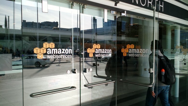 Entrance doors with Amazon Web Services logo visible.