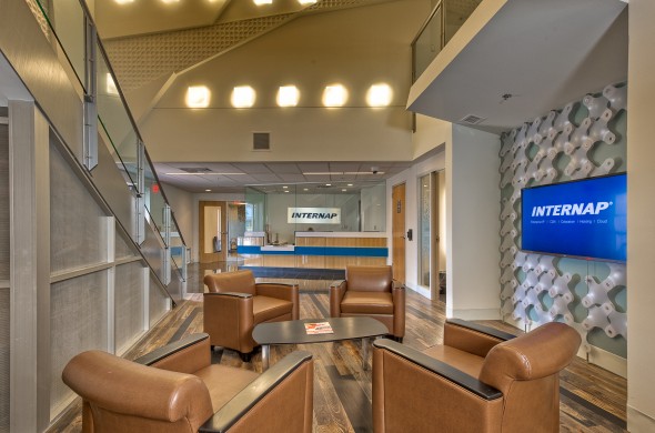 Modern office lobby with seating and a reception area for Internap.