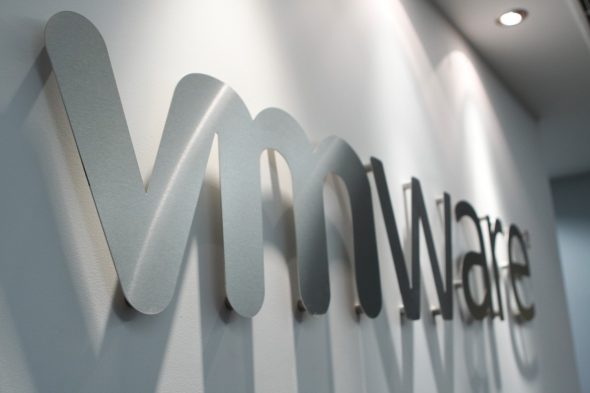 Logo of VMware displayed on a wall.