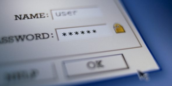 Close-up of a computer login screen showing username and password fields with asterisks for password protection.