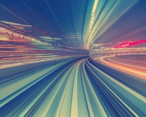 An abstract image representing motion blur with vibrant colors and dynamic lines,creating a sense of speed and movement.