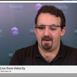 A speaker wearing smart glasses during a presentation at the Velocity conference in Santa Clara,California.