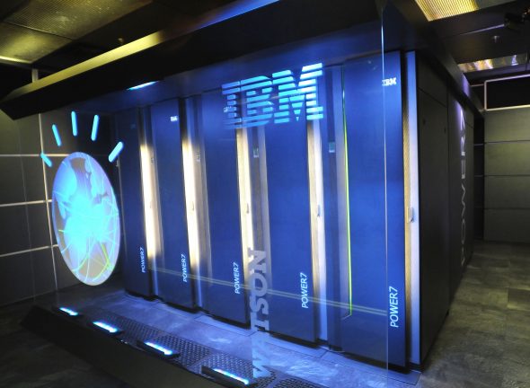 An IBM computing system with multiple server units,featuring the IBM logo and a globe graphic.