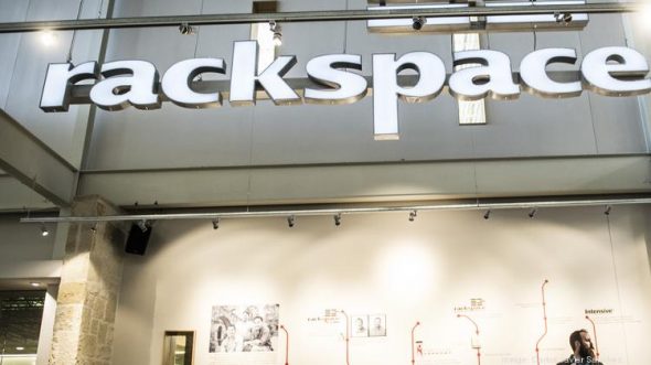 A prominent sign displaying the name 'rackspace' inside a modern building.