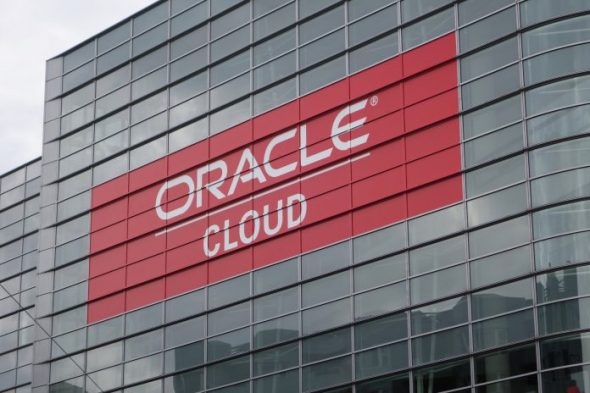 A building featuring a prominent sign that displays 'Oracle Cloud' in white lettering on a red background.