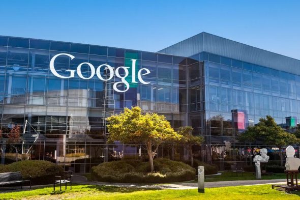 Exterior view of the Google headquarters building with the logo prominently displayed.