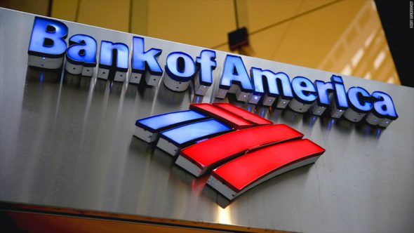 Signage for Bank of America featuring the logo and name in illuminated letters.