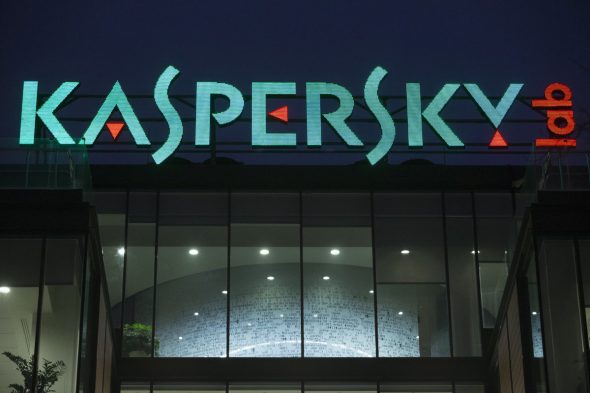 Illuminated sign of Kaspersky Lab during nighttime.