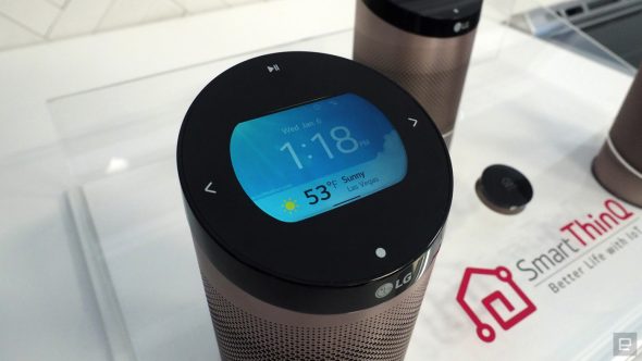 An LG smart speaker with a display showing the time and weather information.