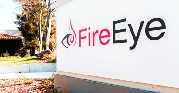 Sign displaying the FireEye logo in an outdoor setting.