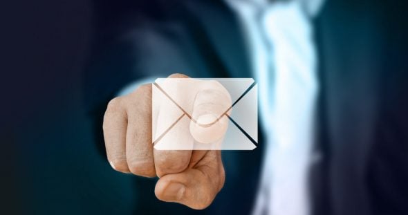 A hand pointing toward an envelope icon