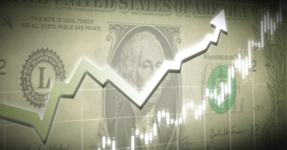 An upward trending graph superimposed on a background of a U.S. dollar bill.