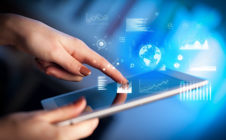 A close-up of a hand touching a tablet screen