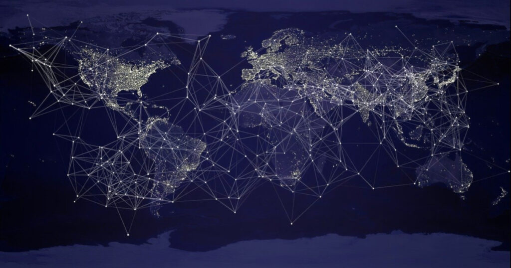 A digital representation of a world map highlighting illuminated city areas connected by a network of lines.