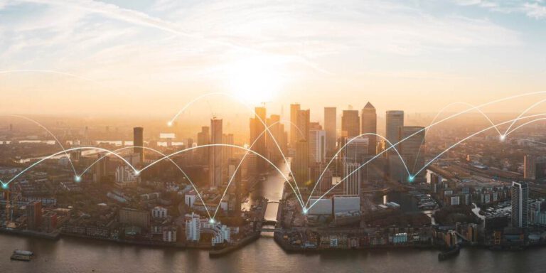 A panoramic view of a city skyline during sunset