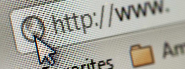 A close-up view of a computer screen showing a web browser's address bar with the cursor hovering over the 'http://' text.