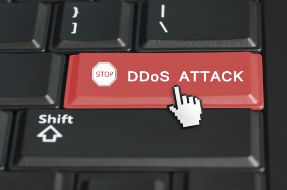 A keyboard with a red key labeled 'STOP DDoS ATTACK' and a cursor icon hovering over it.