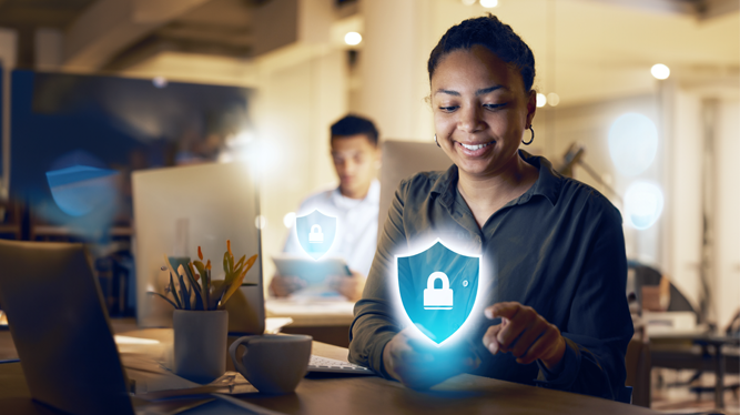 A woman smiling while interacting with a digital security icon on her device