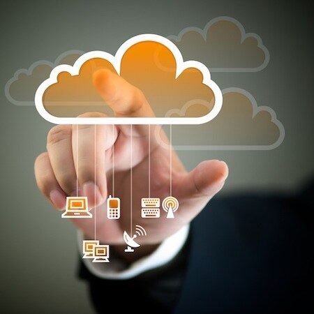 A hand reaching towards a graphic of a cloud with various technology icons