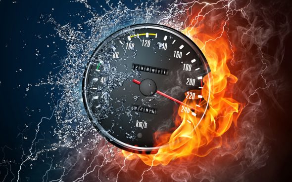 A speedometer with flames and water splashes surrounding it,representing extreme speed and motion.