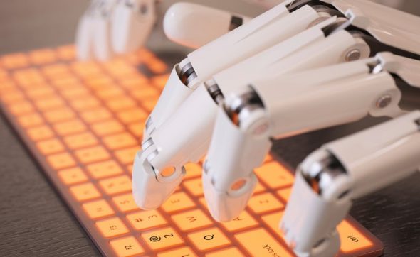 A close-up of robotic hands typing on a backlit keyboard.